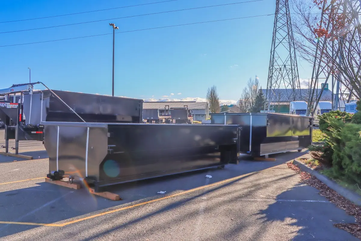Roll-off dumpster ready for waste disposal at job site for Demolition Dumpster Rental in Monmouth